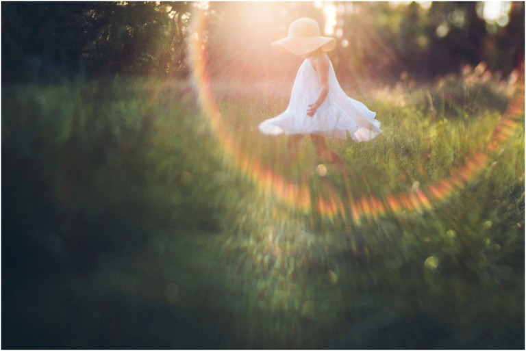 Jacksonville family. newborn and maternity photographer.Little girl dancing in the rainbow | jacksonville children photographer