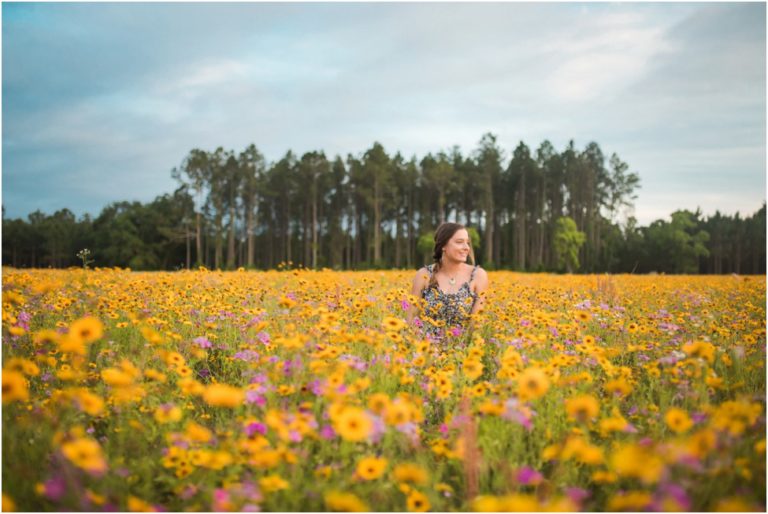 Picking up flowers with this senior | Senior photographer Jacksonville Florida