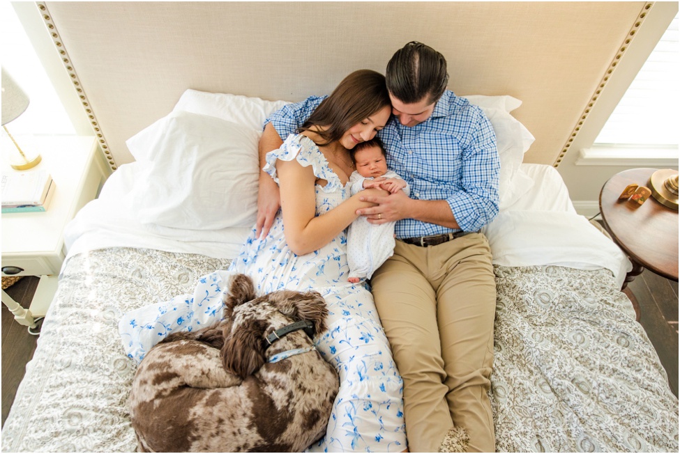 Ponte Vedra newborn photographer. Jacksonville baby session. At home family photos with 7 days old baby boy. San Marco parents with their new son. New baby boy and his furry friend