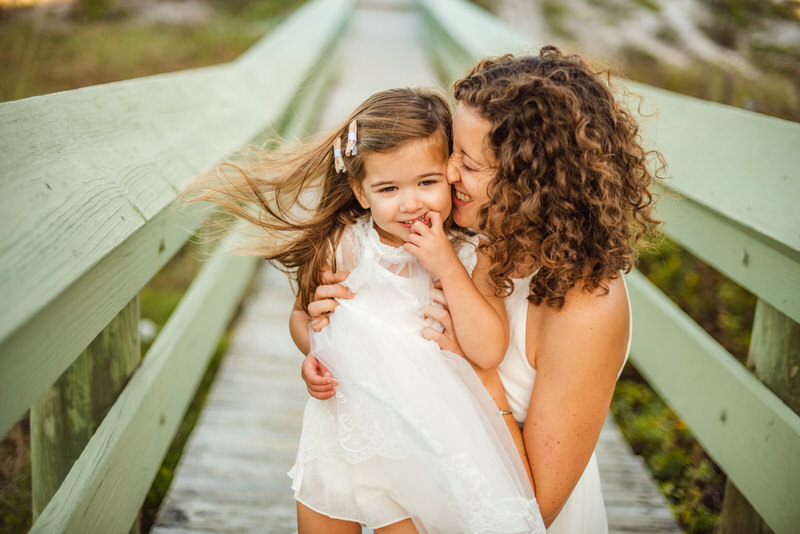 Mommy and me kisses on the jacksonville beach boardwalk