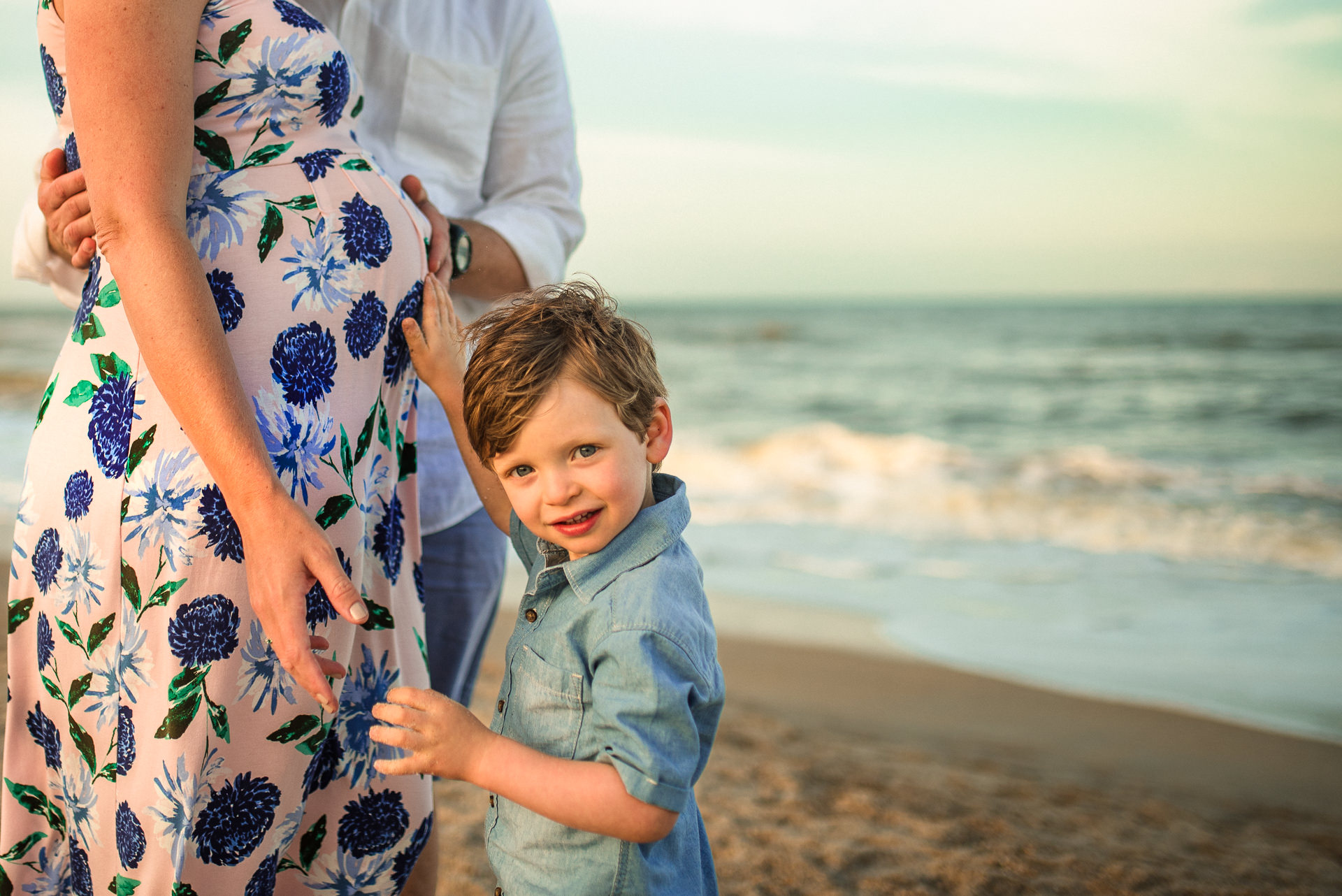 close up of child posing with mother on the beach in a Jacksonville children's photoshoot
