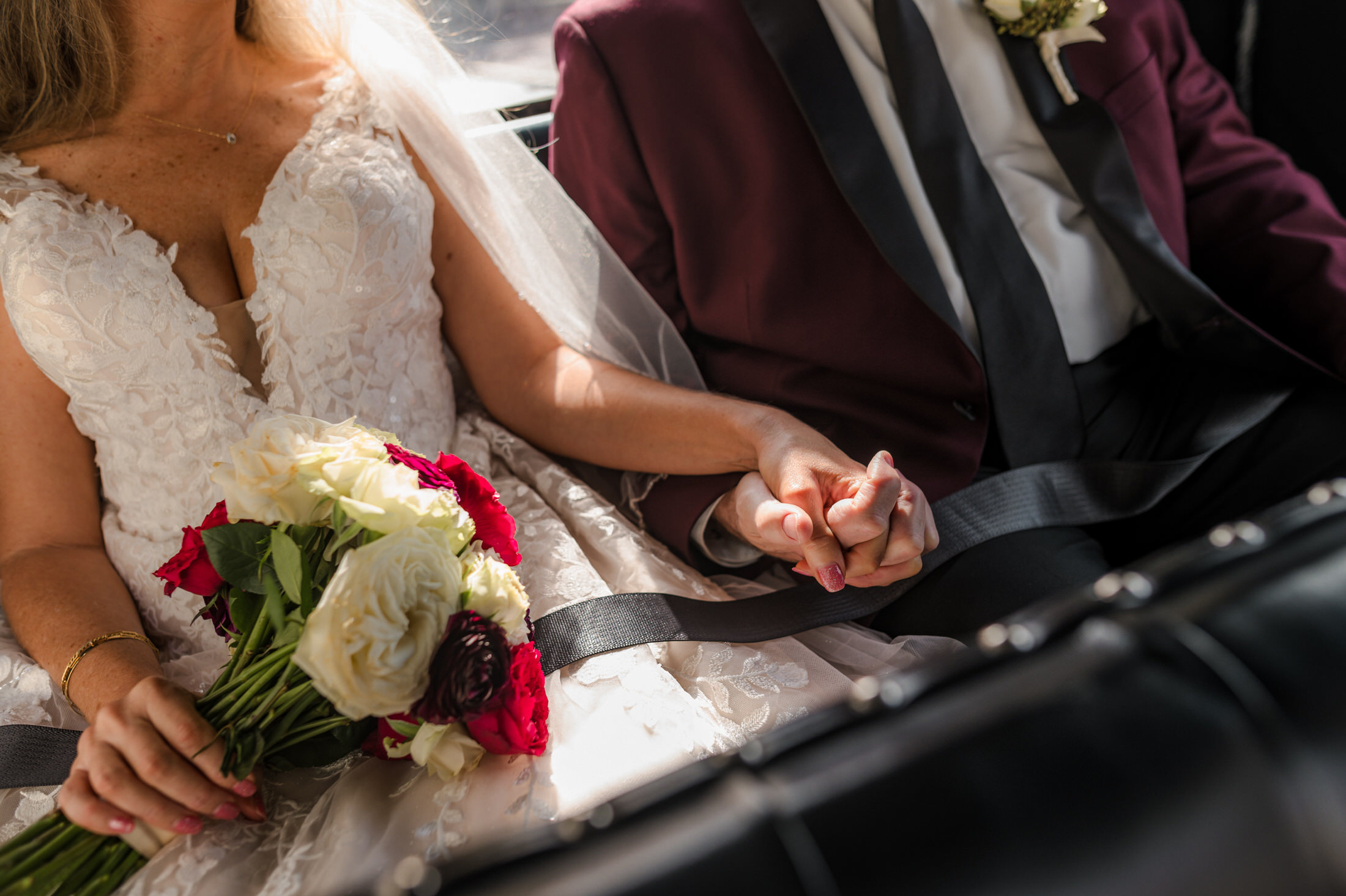 Close up of bride and groom holding each others hands after getting married in a jacksonville wedding photoshoot
