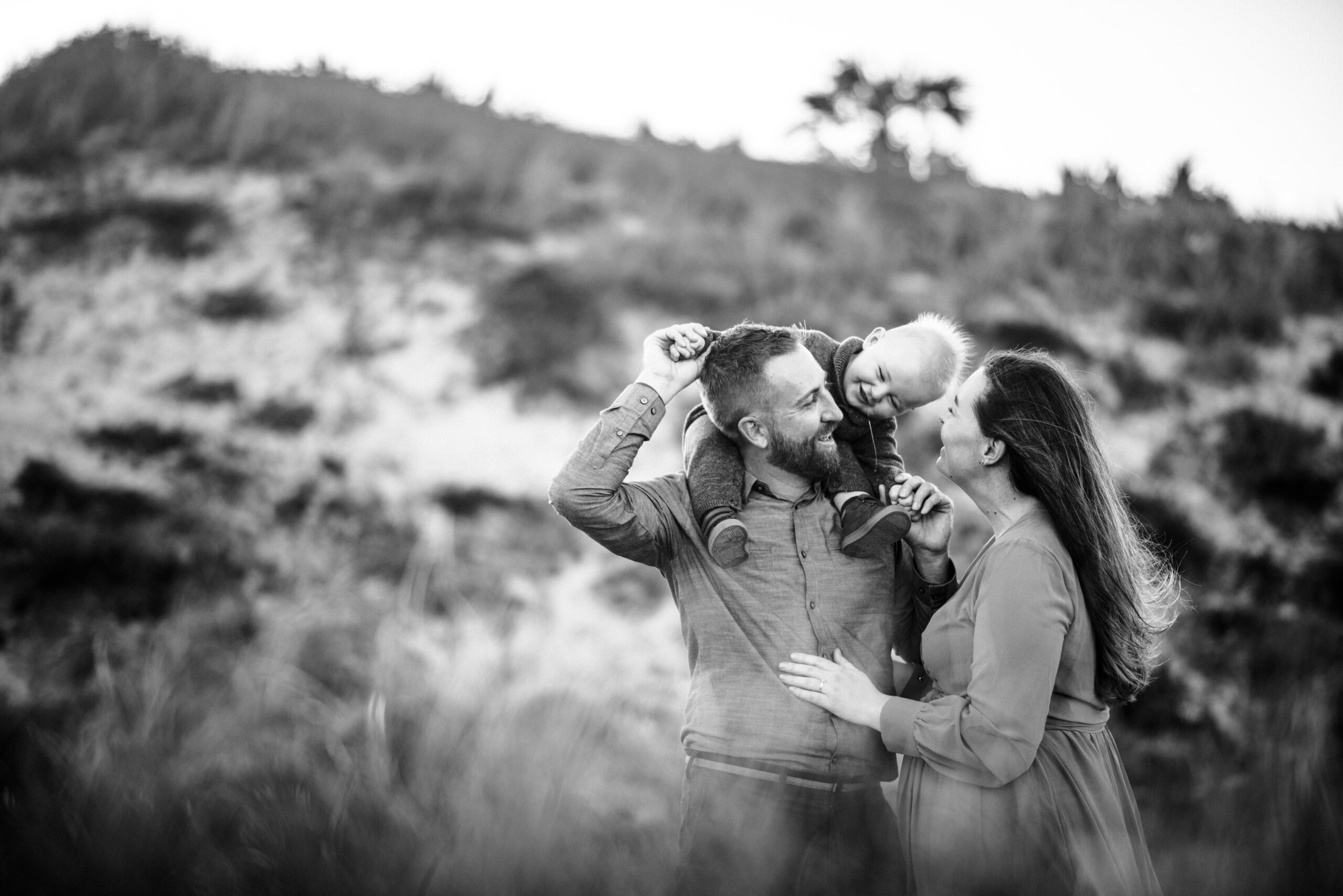 Toddler peeking out from dad's shoulders during their Ponte Vedra Beach family session