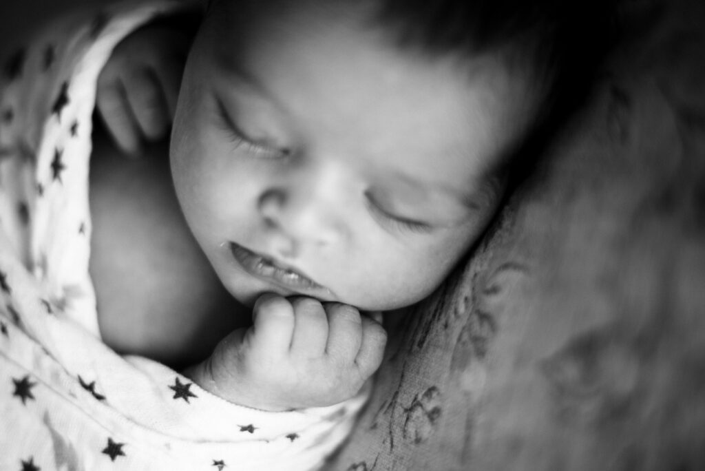 Newborn black and white portrait on 7 day of baby sleeping